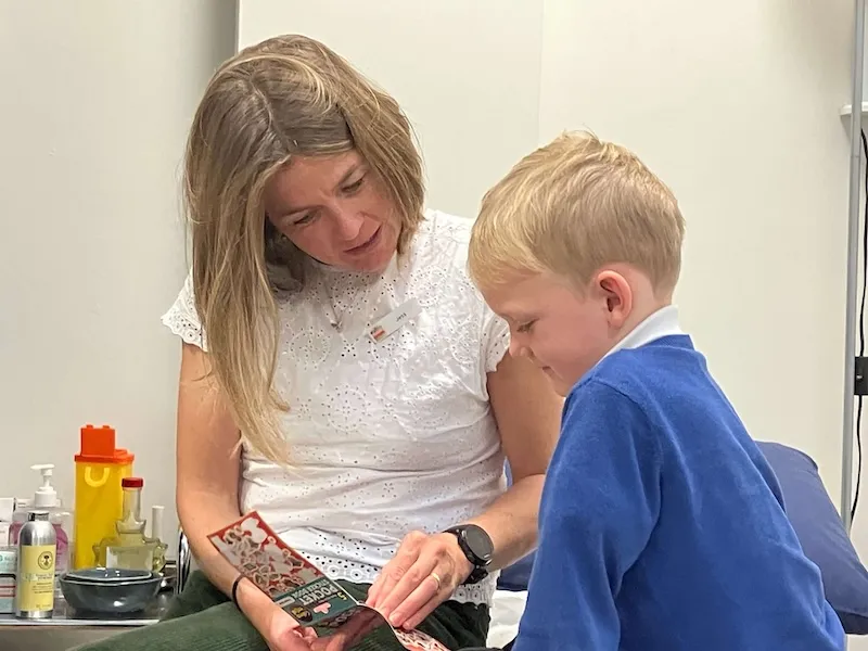 jess with child in an acupuncture session